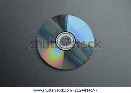 Old computer CDs used for recording information in the 1990s and early 2000s marked in English.