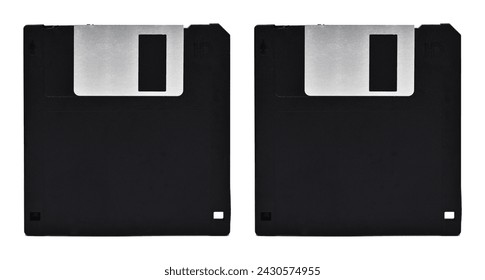 Old computer and data storage technology, two black plastic magnetic floppy disk 3½ inches, isolated on white background