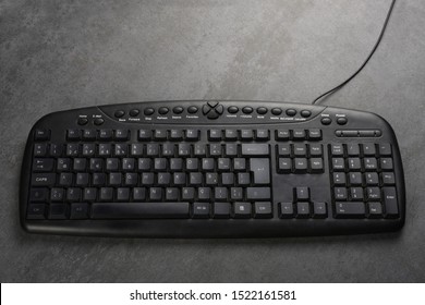 Old Computer Keyboard On Gray Texture With Copy Space