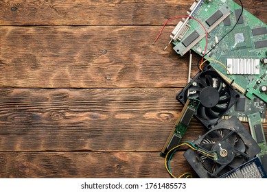 Old Computer Parts On A Wooden Table Flat Lay Background With Copy Space.