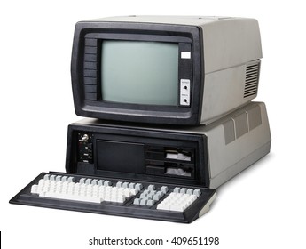 Old computer. The system unit, monitor and keyboard isolated on white background.