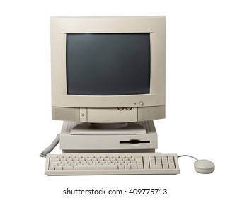 Old Computer. The System Unit, Monitor, Keyboard And Mouse Isolated On White Background.