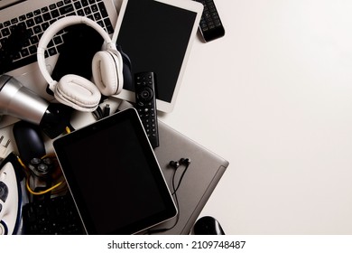 Old Computers, Digital Tablets, Mobile Phones, Many Used Electronic Gadgets Devices, Broken Household And Appliances On White Background. Planned Obsolescence, Electronic Waste For Recycling Concept