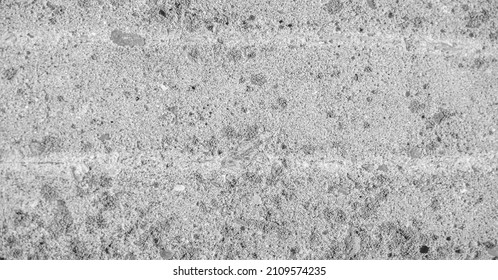 Old concrete construction. Concrete is a composite material consisting of fine and coarse aggregates bonded together with liquid cement (cement paste), which hardens (hardens) over time - Shutterstock ID 2109574235