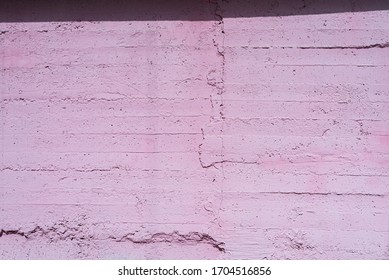 Old Concrete Facade Wall Painted With Pastel Pink Color