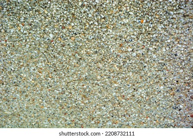 An Old Concrete Slab With Small Pebbles