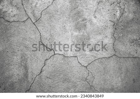 Old concrete wall background.Beautiful cracks in concrete or plaster in cracks