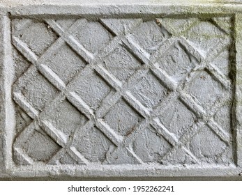 Old Concrete Wall With Embossed Diamond Pattern.