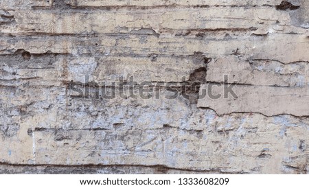 Old concrete wall texture, peeled by weather wallpaper background pattern. 
