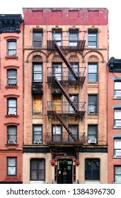 Old condemned building with boarded windows in the Lower East Side neighborhood of Manhattan in New York City NYC