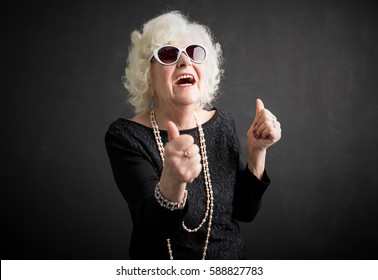 Old And Cool Woman Showing Both Thumbs Up 