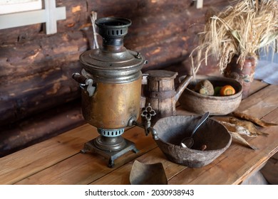 An Old Copper Samovar On The Table In A Rural House, Russia.