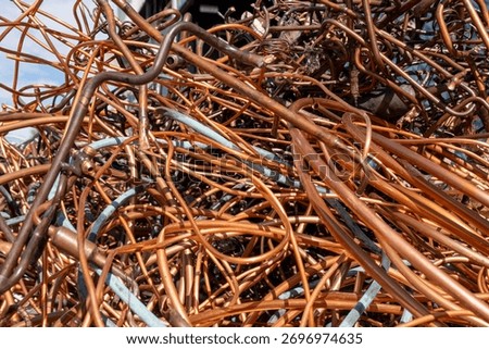 Old and corroded copper tubes from air conditioners. Scrap copper air conditioner pipes ready for recycling. Close-up of old copper pipes with oxidation and patina.