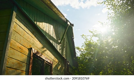 Old Cottage With Trees On A Sunny Day. Russian Dacha.