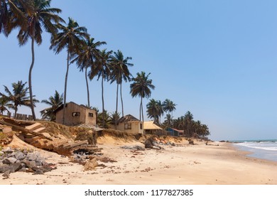 Old Cottages And Palm Trees On Sankofa Beach Ghana, Near Accra City