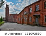 Old cotton spinning mill buildings of red brick in Forssa, Finland