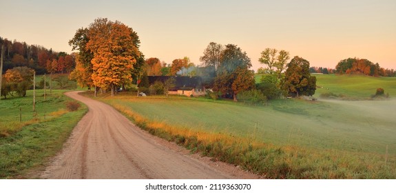 An old country asphalt road through the village, green hills, trees and fields. Traditional house close-up. Russia. Autumn rural scene. Architecture, agriculture, farm, ecology. countryside, tourism - Shutterstock ID 2119363070