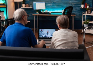 Old Couple Calling Doctor On Video Call Conference For Remote Appointment To Receive Prescription Treatment And Pills. Retired Husband And Wife Using Telemedicine For Online Consultation