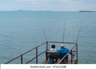 Old Couple Fishing After Retirement In The Sea Beach