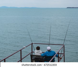 Old Couple Fishing After Retirement In The Sea Beach