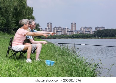 Old Couple Fishing By The Lake High Quality Photo