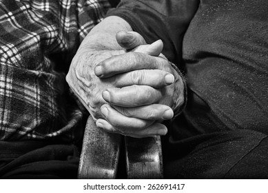 Old couple holding hands