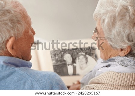 Old couple, photo album and memory nostalgia to remember wedding in retirement for connection, bonding or together. Elderly man, woman and photography book for union commitment, rear view or past