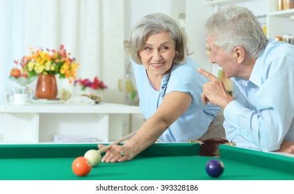 Old Couple Playing Billiard