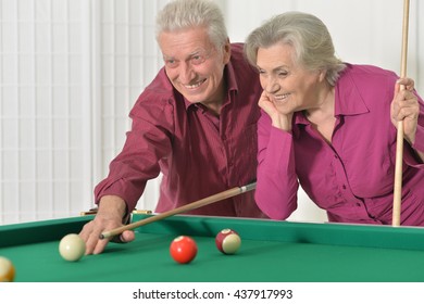 Old Couple Playing Billiard