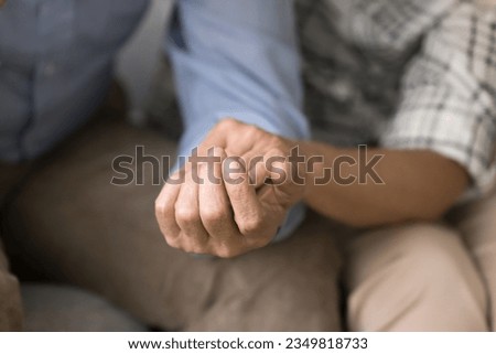 Old couple sharing stress, problems, going through crisis together. Senior husband and wife holding hands, giving comfort, support, empathy, consoling each other. Close up of arms Stock photo © 