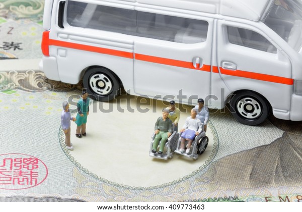  Old couple sitting in\
wheelchair