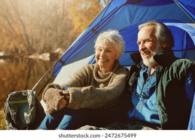 Old couple, tent and camping with nature, sunshine and vacation with hobby, retirement and field. Outdoor, senior man or mature woman with holiday, getaway trip or relax with weekend break and love - Powered by Shutterstock