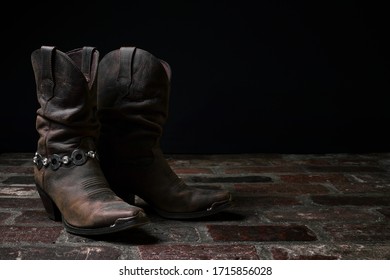 Old Cowgirl Boots Wait In The Shadows For Another Chance To Dance The Two Step