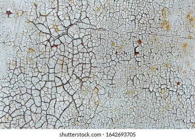 Old Cracked White Coat Of Paint Background With Leaky Rust