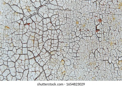 Old Cracked White Coat Of Paint Background With Leaky Rust