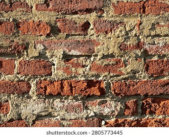 Old cracky bricks texture background in grazing light.