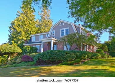 Old craftsman brick house with summer beautiful landscape