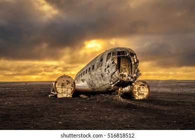 Old crashed plane abandoned on Solheimasandur beach near Vik in Iceland with heavy storm clouds in the sky. Hdr processed