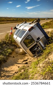 An old crashed van on the side of a road