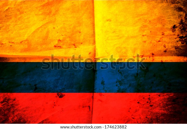 Old
creased paper with Colombian flag as the
background