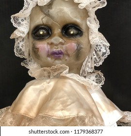 Old Creepy Baby Doll In Old Fashioned White Lace Outfit