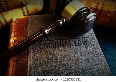 Old Criminal Law Books And Court Gavel                               