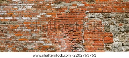 Old crumbling brick wall, detail.
