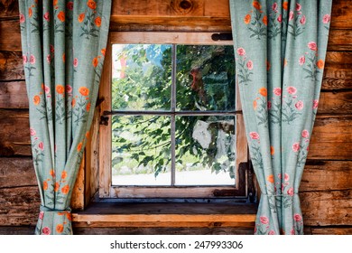 Old Curtains At A Rundown Window