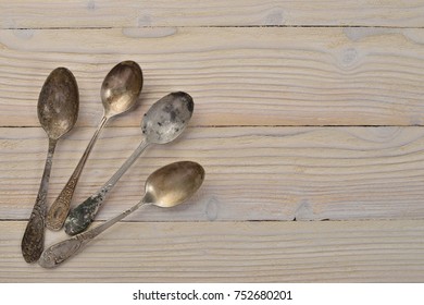 Old cutlery. On a wooden background. Top view. Free space for text.