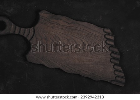 Old cutting board for serving dishes. A wooden board for serving food.