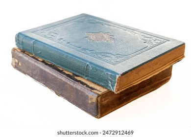 Old damaged books stacked on top of each other. Yellowed natural paper texture. On isolated white background. Clean close-up. - Powered by Shutterstock