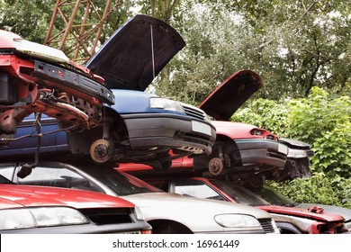 Old Damaged Cars In A Breakers Yard