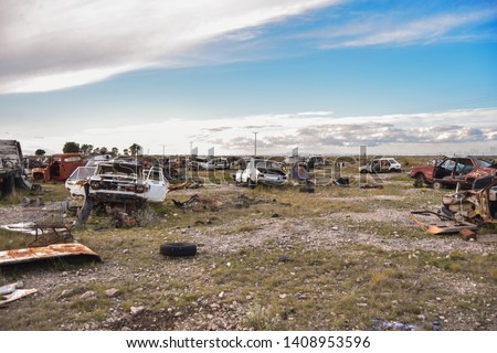 Old damaged cars on the junkyard waiting. Cemetery of cars.