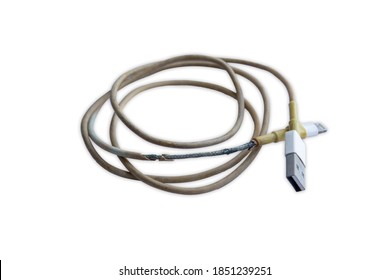 Old And Damaged Phone Charger Cord On White Background.Die Cut.